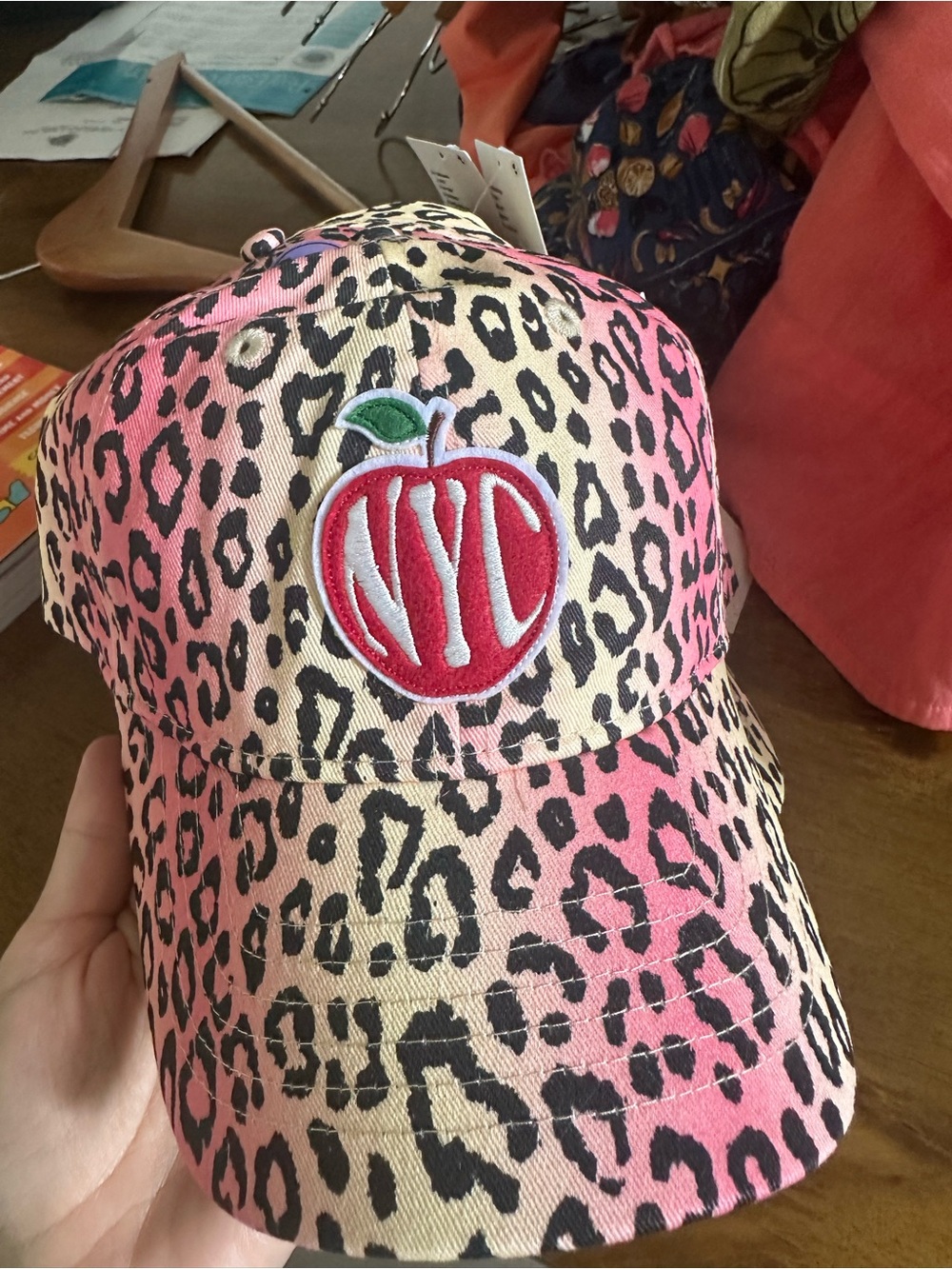 Urban Outfitters Pink Leopard Print Cap with Red Apple Patch